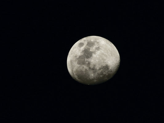 full moon in dark night sky