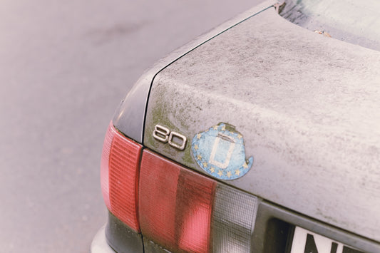 A close up of a car parked on the side of the road