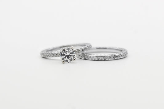 silver diamond studded ring on white surface