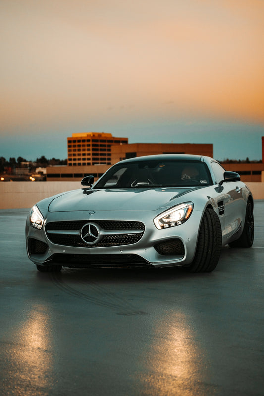silver mercedes benz coupe on road during daytime